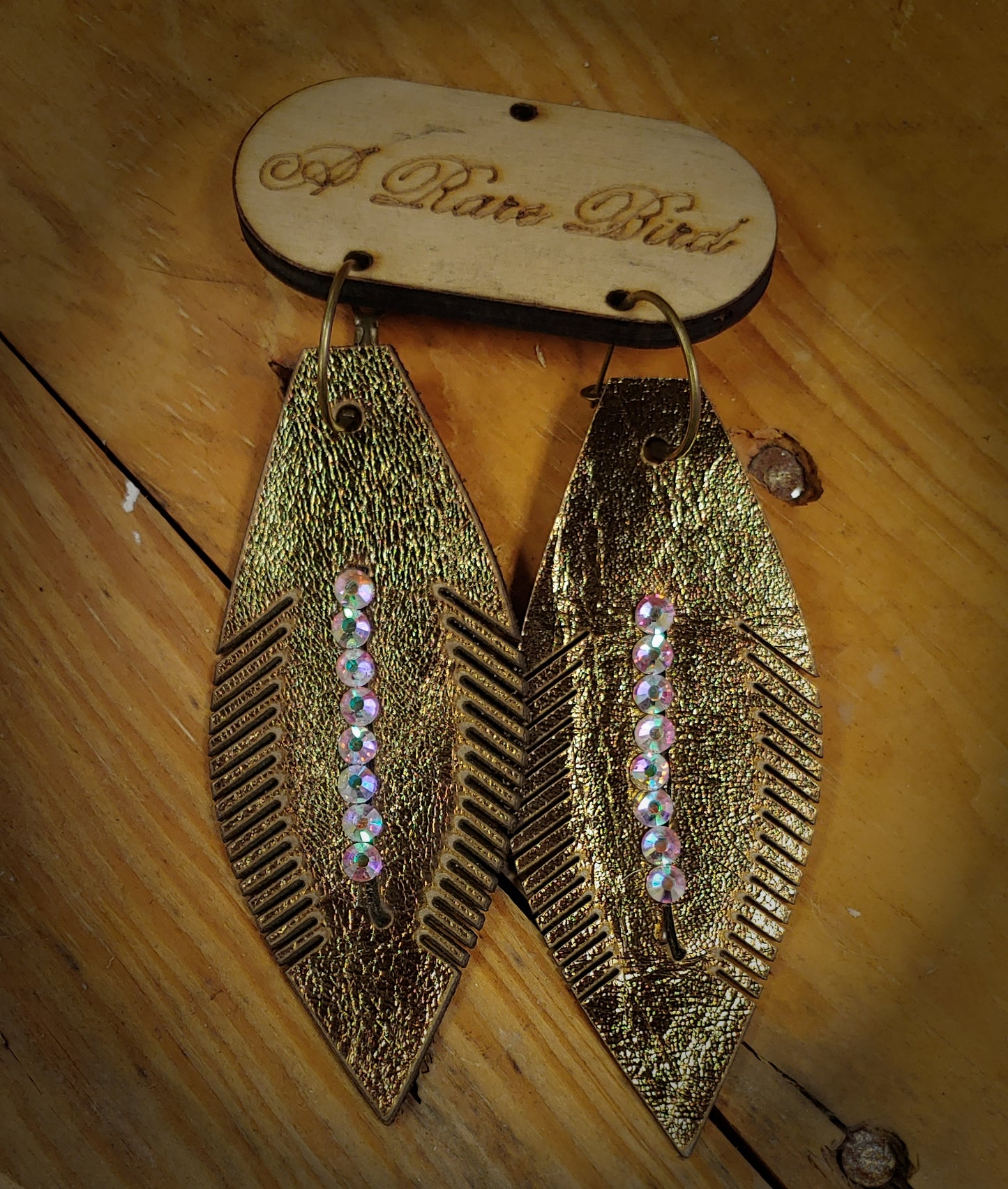GOLD LEATHER FEATHER EARRINGS